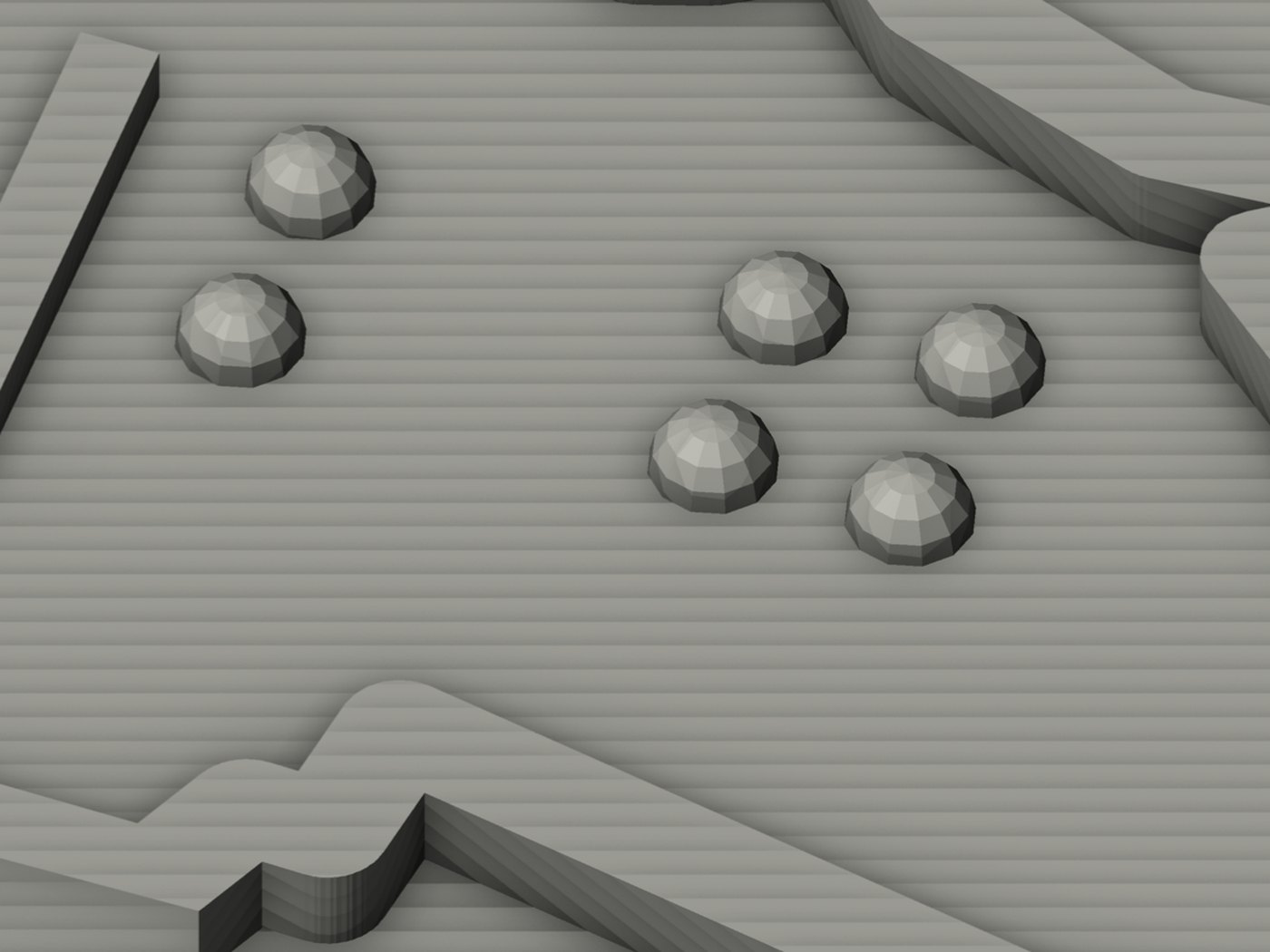 Close render of a single braille number label on the map: a narrow upright anchor ridge on the left, then braille cells of rounded domed dots raised above the plate, with a border ridge running past.